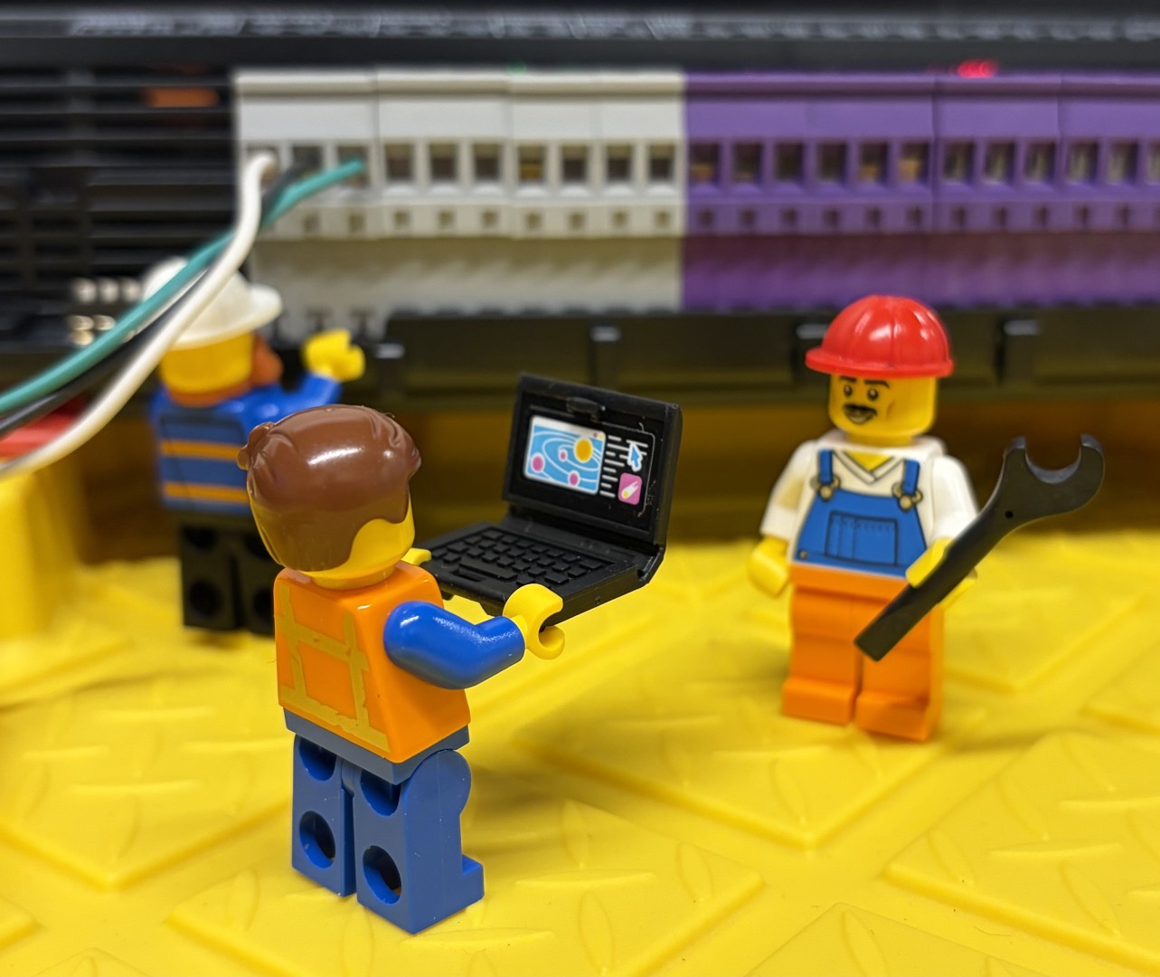 Lego men checking alarm systems